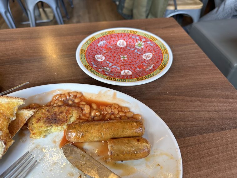Close-up of sausages, beans and fried bread